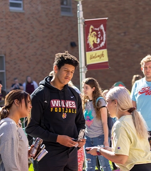 Students outside talking with each other